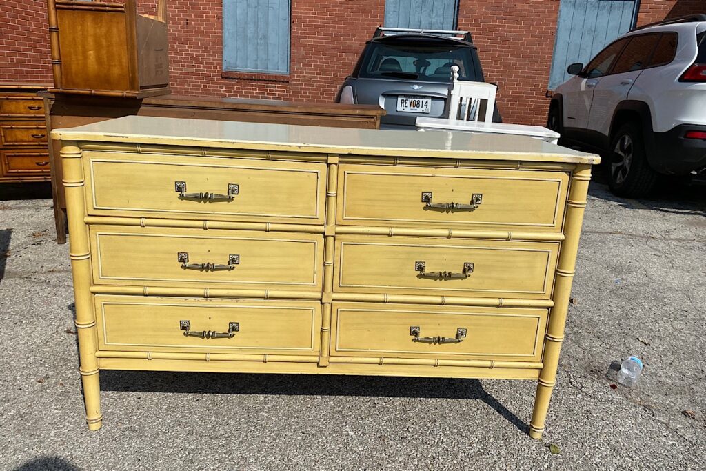 Dated yellow faux bamboo dresser 