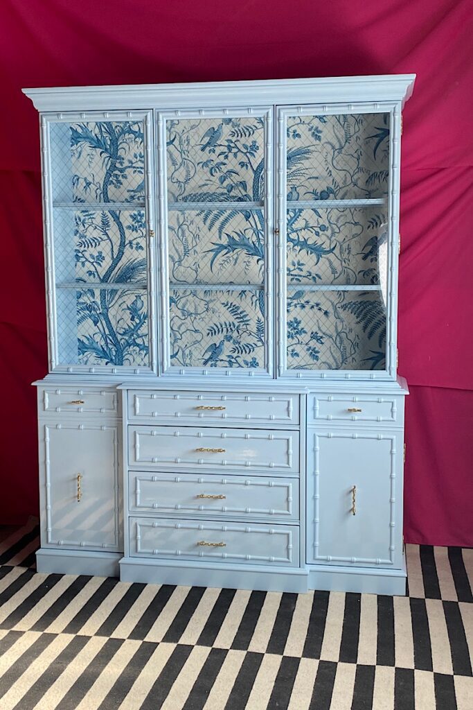 Pale blue china cabinet with Bird and Thistle paper