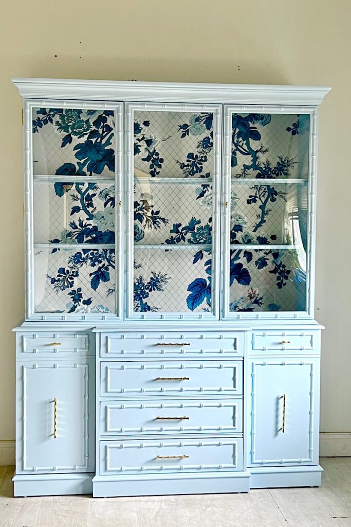 Jasper china cabinet with Schumacher Pyne Hollyhock paper 