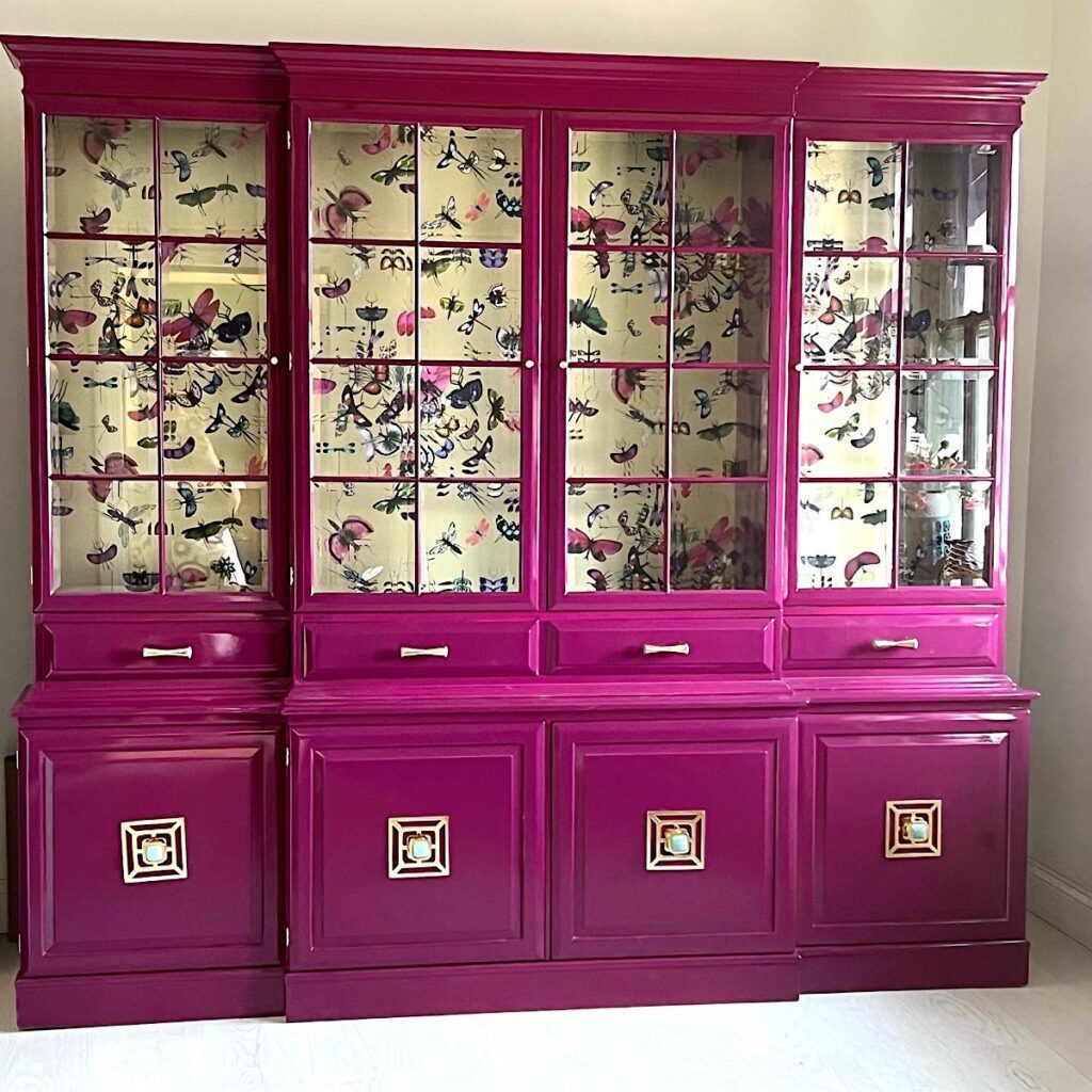 vintage china cabinet in magenta pink 