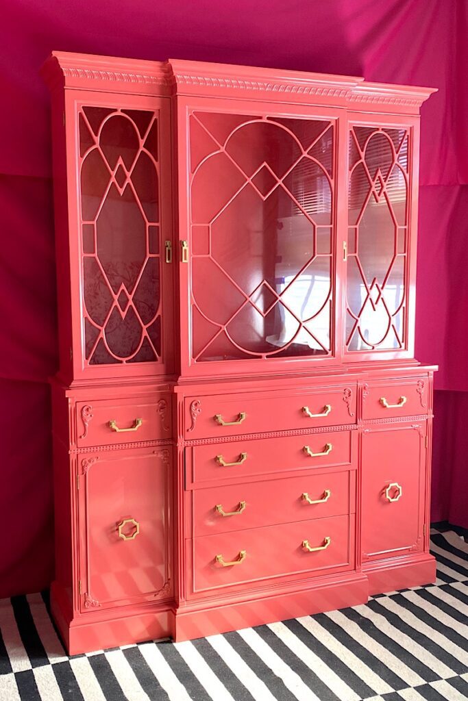 Traditional china cabinet in coral lacquer 