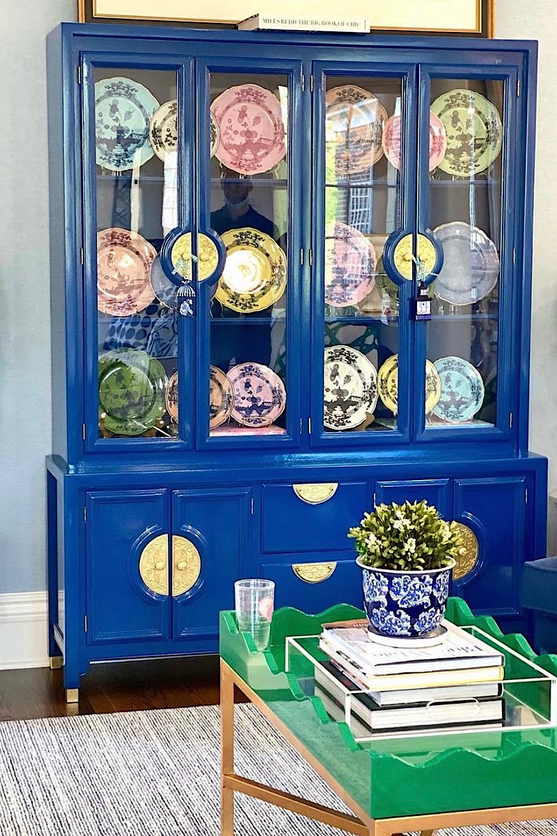 Blue china cabinet with plates displayed