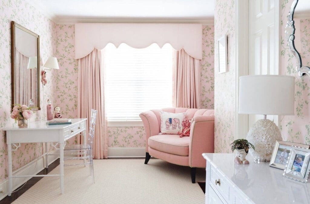 Blush pink nursery with faux bamboo furniture 